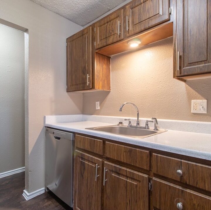 MC 4 kitchen area with sink and wood cabients and dishwasher